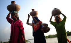 Women carry water on heads