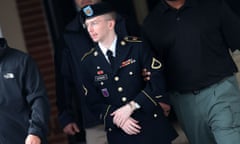 FORT MEADE, MD - AUGUST 20:  US Army Private First Class Bradley Manning is escorted out of a military court facility  during the sentencing phase of his trial August 20, 2013 in Fort Meade, Maryland. Manning was found guilty of several counts under the Espionage Act, but acquitted of the most serious charge of aiding the enemy.  (Photo by Mark Wilson/Getty Images) Crime Justice Law Politics