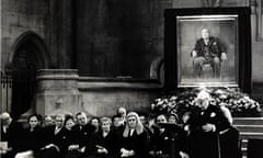 Winston Churchill with his portrait in the background