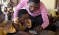 Pupils at Suhum primary school in Ghana read their e-readers