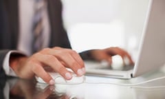 Man in suit using laptop