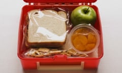 A lunch box with a sandwich and snacks --- Image by   Rubberball/Rubberball/Corbis baked good bread citrus fruit close-up view container cracker cutting drink education food fruit green apple indoors lunch lunchbox many meal nobody open orange plastic prepared food produce sandwich school serenity slice slicing snack solid still life view from above