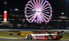 The Action Express Racing Corvette DP heads through the horseshoe turn during night practice for the IMSA Series Rolex 24 hour auto race at Daytona International Speedway in Daytona Beach, Florida, Thursday, January 23, 2014