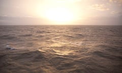 Sunset over Brighton sea, photographed from the end of the pier