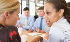 Women talking to each other during meeting