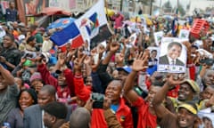 A crowd cheer during a political rally in Maputo.