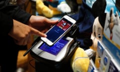 Apple Pay in use at a Disney Store. The US company's results failed to lift key chip supplier Arm. Photo: Jason DeCrow/Invision for Disney/AP Images