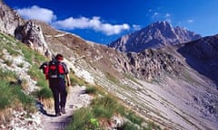 Walker walking on mountain in Italy