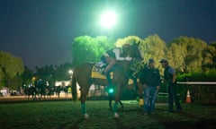 Willie Delgado pats California Chrome as they wait for a workout at the Breeders' Cup