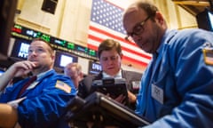 Traders at the New York Stock Exchange awajt news from the Federal Reserve. Photo: Reuters/Lucas Jackson