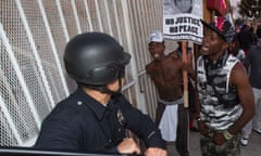 Protesters confront police following George Zimmerman's acquittal for the killing of Trayvon Martin.