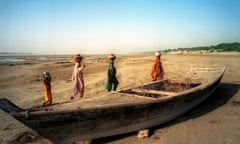 An abandoned  boat on the dry bed of the Indus River