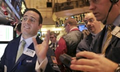 Traders at the New York Stock Exchange as markets surge. Photo: Seth Wenig/AP.