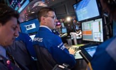 Traders at the New York Stock Exchange as the Dow passed 18,000. Photo: Andrew Burton/Getty Images