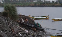 Fishermen dock their boats at Manila Bay as Typhoon Hagupit (locally known as Ruby) approaches on 7 December 2014, Pasay City, Philippines.