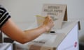 A woman casts her vote for in the Victorian state election in Melbourne