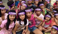 Children mark the One Billion Rising day of action against violence against women in Tondo, Manila, the Philippines.