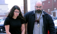 Miranda Barbour, who claims involvement with a satanic cult, being led by a Sunbury policeman.