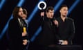 Arctic Monkeys accept British Group Award.