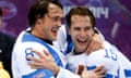 Teemu Selanne and Tuomo Ruutu of Finland  celebrate a 5-0 victory over Team USA in the men's bronze medal ice hockey game at the 2014 Winter Olympics.