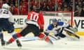 Chicago Blackhawks' Patrick Sharp scores past St. Louis Blues goalie Ryan Miller in game six of the first round of the 2014 Stanley Cup Playoffs.