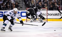 Los Angeles Kings' Dustin Brown is tripped by San Jose Sharks' Joe Thornton during Game 6 of their first-round playoff series.