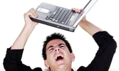 Angry man holding laptop