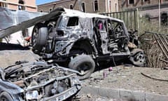Damaged vehicles are seen at the scene of a suicide attack at the Defence Ministry compound in Sanaa