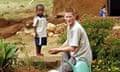 Prince Harry with orphan Mutsu Potsane at the Mants'ase Children's Home for children orphaned. 2004