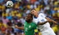 Didier Drogba of Ivory Coast and Jose Holebas of Greece clash as they both go for a header.