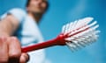 Man holding cleaning brush