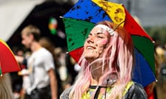 A festival goer looks towards the sun at glastonbury