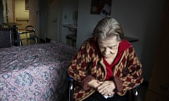 Woman sits in her room