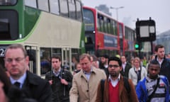 Commuters walk across Waterloo Bridge in London, on April 29, 2014, as a planned 48 hour underground train strike came into effect late Monday night. Workers on London's Underground train system began a 48-hour strike at 9:00 pm (2000 GMT) on Monday, threatening chaos for commuters and hitting football supporters attending Arsenal's match with Newcastle.   AFP PHOTO / CARL COURTCARL COURT/AFP/Getty Images