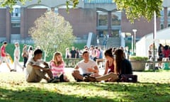 Students sat on the grass during a university open day