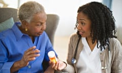 Nurse explaining medication to woman