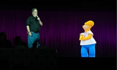 The Simpsons creator Matt Groening introducing Homer Simpson to the audience at Comic Con.
