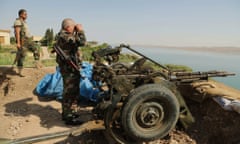 Kurdish forces stand guard near Mosul Dam at the town of Chamibarakat outside Mosul. Kurdish peshmerga fighters took control of the dam on Sunday with the help of US air strikes.