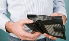 A man holding an empty wallet