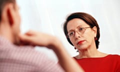 A man having a consultation with a female doctor