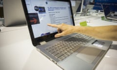 A shopper inspects an HP laptop computer in a Best Buy electronics store in New York.