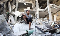 A Palestinian boy amid ruined houses in Beit Lahiya as the 72-hour ceasefire went into its third day