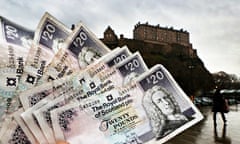 Twenty pound notes seen in front of Edinburgh Castle.