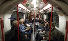 View of passengers looking serious on a London tube train