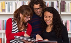 international students reading a book