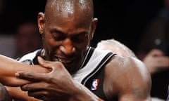 Brooklyn Nets' Kevin Garnett has to be restrained after an altercation with Houston Rockets' Dwight Howard during the first quarter of an NBA basketball game.