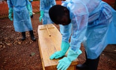 Men in Sierra Leone prepare to take a coffin to a burial