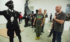Jake (foreground) and Dinos Chapman installing a 2011 exhibition of their artworks.