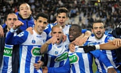 Grenoble's players celebrate with supporters after winning their French Cup match against Marseille