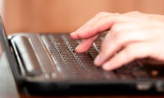 close up of woman typing on computer